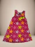 Vestido infantil da Linha Mini Encantos com estampa de estrelas coloridas em fundo rosa