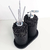 Essenza Volcano Lavatory Kit featuring two black stone containers with a pump and reed sticks on a tray.