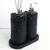 Essenza Volcano Lavatory Kit featuring a sleek black design with textured stone-like finish, including a soap dispenser and a holder for aroma sticks.