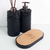Essenza Volcano Lavatory Kit featuring two sleek black dispensers and a cork tray.