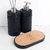 Essenza Volcano Lavatory Kit featuring two black textured containers and a cork tray.