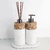 Kit lavabo Atenas com dispenser e difusor em pedras naturais e base branca.