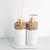Kit Lavabo Atenas com dispenser e difusor de ambiente, adornado com pedras naturais e detalhes em dourado.