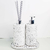 Kit Lavabo Milão com dispenser de sabonete e difusor de ambiente em base de concreto branco.