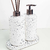 Kit Lavabo Milão com dispenser e difusor de ambiente em base de pedra branca com manchas pretas.