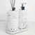 Kit Lavabo Milão com dispensador de sabonete e difusor de aromas em base branca com detalhes pretos.