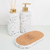 Kit Lavabo Milão com dispensador e difusor em material branco com detalhes em dourado, acompanhado de uma base de cortiça.