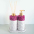 Kit Lavabo Malaya com frascos decorativos em tom de rosa e detalhes em dourado.