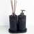 Kit lavabo Roma com dispenser e difusor de aroma, acabamento em pedras pretas e base preta.