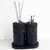 Kit Lavabo Roma com dois recipientes de decoração, um para sabonete líquido e outro para difusor, ambos com base preta e acabamento em pedras escuras.