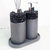Kit Lavabo Tóquio com dois dispensadores e suporte, apresentando design sofisticado em tons de cinza e detalhes em pedra.