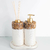 Kit Lavabo Duna com dispensador e difusor, decorado com pedras naturais e detalhes em dourado.