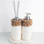 Kit Lavabo Duna composto por dois frascos decorativos com pedras naturais, um com bomba dosadora e outro com palitos aromáticos, em uma base elegante.