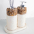 Kit lavabo Duna com frascos decorativos em pedras naturais e base branca, ideal para decoração de espaços.
