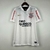 Camisa retrô do Corinthians 2010, modelo home I, na cor branca, com detalhes em dourado e estampas do patrocinador.