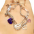 Pulsera combinada en acero quirúrgico 316L con dije cristal corazón SW. violeta azulado heliotropo