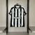 camisa modelo torcedor do botafogo i temporada 25/26 listrada nas cores preto e branco pendurada num cabide