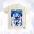Camisa Legends do Real Madrid com design que destaca jogadores e o treinador, incluindo o troféu da UEFA Champions League.