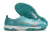 Turquoise Mizuno soccer cleats with a textured upper and distinctive studded outsole.