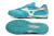 Turquoise soccer shoes with a white logo and textured upper, featuring a rubber sole design.