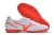 White and orange soccer cleats with a sleek design and textured sole