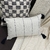 Capa para Almofada Baguete Crua Listrada com Pompom Preto - comprar online