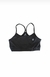 Top básico negro con tiras finas, ideal para uso diario y actividades deportivas.