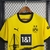 Camisa Borussia Dortmund BVB I Home Titular 23/24 - Torcedor Masculina - Amarela. grafismo do signal iduna park, muralha amarela 2023-2024