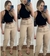 Calça de alfaiataria com detalhe de ziper na perna.