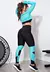 Calça legging preta com detalhes em azul turquesa e cropped de telinha manga longa, modelo fitness.