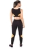 Conjunto fitness cropped preto com detalhes em amarelo e calça legging, vista traseira da modelo.