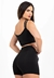 Conjunto fitness preto com cropped de alça dupla e short cintura alta, modelo feminino.