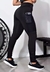 Calça legging fitness preta com bolso em tela, destacando o celular na lateral.