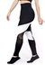 Calça legging cintura alta assimétrica com detalhe em branco e têxtil em tulê e tela preta, vista lateral.