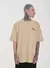 Camiseta Oversized Estampada Face (Areia) na internet