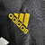 Camisa retrô do Real Madrid II 11/12, manga longa, na cor preta com detalhes em dourado, fabricada pela Adidas.