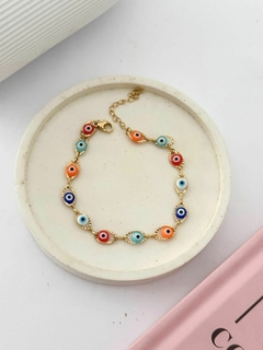 Pulsera ojitos dorado color