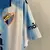 Camisa Málaga I 23/24 - Torcedor Hummel Masculina - Branca com detalhes em azul