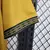 Imagem do Camisa Rayo Vallecano III 23/24 - Torcedor Umbro Masculina - Dourado com detalhes em preto e branco