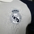 Camisa Real Madrid Treino 24/25 polo - Jogador Adidas Masculina - Branca com detalhes em azul - loja online