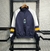 Jaqueta Corta-Vento Arsenal 23/24 - Azul com detalhes em branco e amarelo
