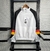 Jaqueta Corta-Vento Flamengo 23/24 Masculina Adidas - Branco com manga preta e com detalhes em vermelho e amarelo