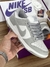 Tênis Nike Dunk Low Retro Cinza e Branco na internet