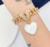 Pulseira Elo Grumet com Pingente de Coração Madre Pérola Semijoia Ouro 18K (sob encomenda) na internet
