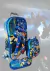 Mochila Infantil Escolar Transformer 3d Com Rodinhas Lancheira e Estojo - comprar online