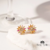 Brinco de flor com cristais coloridos - comprar online