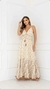 Vestido longo boho chic em tom bege, com detalhes em poás e bordados, modelo com alças finas e decote em V.