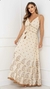 Vestido longo boho chic em tom bege, com detalhes em poás e bordados, modelo com alças finas e decote em V.
