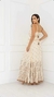 Vestido longo boho chic em tom bege, com detalhes em poás e bordados, modelo com alças finas e decote em V.