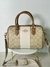 Bolsa Coach con strap de tela grabado